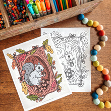 Load image into Gallery viewer, Coloring pages with a squirrel design, markers, and pom-poms on a wooden surface