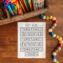 Load image into Gallery viewer, Stamp themed reading tracker page on a wooden surface with colored markers and pencils.