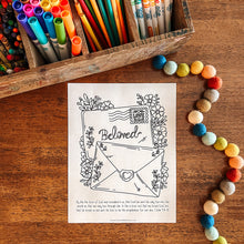 Load image into Gallery viewer, Coloring sheet with envelopes and flowers on a wooden surface with colored pencils and beads.