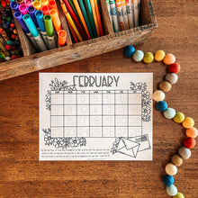 Load image into Gallery viewer, February calendar on a wooden surface with colorful markers and beads.