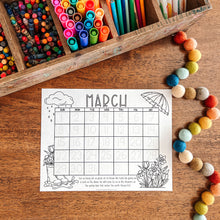 Load image into Gallery viewer, March calendar on a wooden surface with colorful markers and beads.