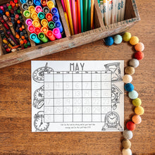 Load image into Gallery viewer, Colorful stationery items including crayons, markers, and pencils on a wooden surface with a May calendar sheet.