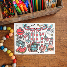 Load image into Gallery viewer, Colorful stationery items including markers, crayons, and pencils in a wooden box on a wooden surface with a 'Happy July' coloring sheet.