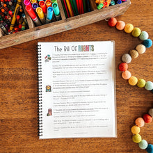 Load image into Gallery viewer, Sheet of paper titled &#39;The Bill Of Rights&#39; on a wooden surface with colorful markers and crayons.
