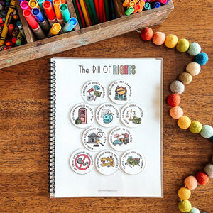'The Bill of Rights' activity on a wooden surface with colorful markers and crayons.