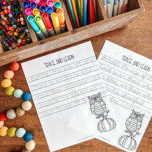 Load image into Gallery viewer, Colorful stationery items including markers, crayons, and Bible verse tracing pages on a wooden surface.
