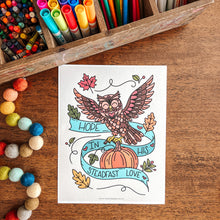 Load image into Gallery viewer, Coloring book page with owl design on a wooden table with art supplies
