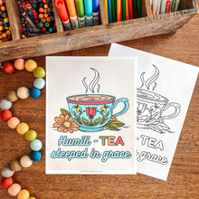 Load image into Gallery viewer, Coloring book with tea-themed pages and coloring supplies on a wooden surface
