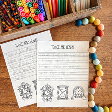 Load image into Gallery viewer, Colorful stationery items including crayons, markers, and pencils on a wooden surface with Bible verse tracing worksheets.
