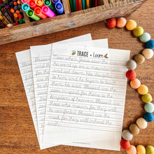 Load image into Gallery viewer, Colorful markers, Beatitudes cursive tracing worksheet, and a wooden box on a wooden surface.
