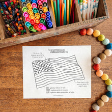 Load image into Gallery viewer, Coloring page with American flag design on a wooden surface with crayons and markers.
