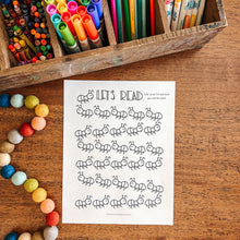 Load image into Gallery viewer, Colorful markers and pencils in a wooden box on a wooden surface with a reading tracker coloring sheet featuring ants.
