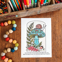 Load image into Gallery viewer, A coloring page featuring a mushroom and snail illustration with a Bible verse printed below, displayed on a wooden table surrounded by colorful pencils, beads, and art supplies.
