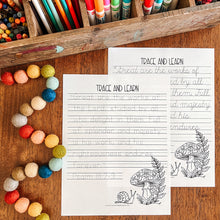 Load image into Gallery viewer, Two printable worksheet pages titled 'TRACE AND LEARN' with lined writing areas and black line drawings of mushrooms, shown on a wooden surface with colorful pencils, markers, and beads around them.
