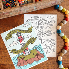 Load image into Gallery viewer, Coloring book with lighthouse design, colored pencils, and pom-poms on a wooden surface
