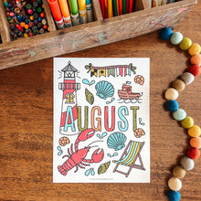 Load image into Gallery viewer, Colorful &#39;August&#39; coloring page with lighthouse, boat, and other summer elements on a wooden surface with coloring supplies.
