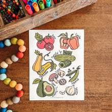 Load image into Gallery viewer, Colorful illustration of fruits and vegetables on a white card, placed on a wooden surface with art supplies.

