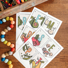 Load image into Gallery viewer, Colorful September banner with vegetable illustrations on a wooden surface with art supplies.
