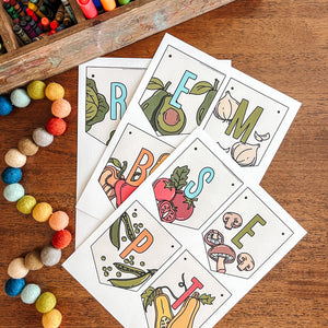 Colorful September banner with vegetable illustrations on a wooden surface with art supplies.