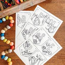 Load image into Gallery viewer, Coloring pages September banner with vegetable illustrations on a wooden surface with art supplies.
